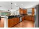 Open kitchen with stainless steel appliances, granite countertops, tiled backsplash, and breakfast bar at 5121 Serata Dr, Lakewood Ranch, FL 34211
