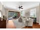 Bright living room with hardwood floors and a view of the screened patio at 5121 Serata Dr, Lakewood Ranch, FL 34211