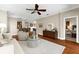 Comfortable living room offering an open layout to the dining and kitchen areas at 5121 Serata Dr, Lakewood Ranch, FL 34211