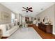 Comfortable living room offering an open layout to the dining and kitchen areas at 5121 Serata Dr, Lakewood Ranch, FL 34211