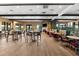A restaurant area offering a mix of table seating and booth style seating and golf course views at 5121 Serata Dr, Lakewood Ranch, FL 34211