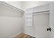 Walk in closet provides ample storage with shelves and rods for organization at 5339 Gulfport Ter, Port Charlotte, FL 33981