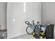 Unfinished garage space with a bicycle, lawn mower, and storage containers at 5339 Gulfport Ter, Port Charlotte, FL 33981