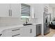 Bright kitchen featuring stainless steel appliances, modern hardware, and lots of counter space at 5339 Gulfport Ter, Port Charlotte, FL 33981