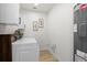 Modern laundry room with a front-load washer and dryer and a neutral paint scheme at 5339 Gulfport Ter, Port Charlotte, FL 33981