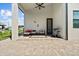 Covered outdoor patio featuring comfortable seating and a gas grill at 5339 Gulfport Ter, Port Charlotte, FL 33981