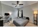 Bedroom with ceiling fan, neutral carpet, and a view of the window and computer desk and chair at 5521 Olano St, Palmetto, FL 34221