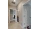 Hallway view with multiple doorways showcasing access to various rooms at 5521 Olano St, Palmetto, FL 34221