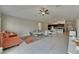Spacious living area featuring contemporary furnishings, tile flooring, and open layout at 5521 Olano St, Palmetto, FL 34221