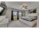 Well-lit main bedroom with plush carpet, large windows, and stylish decor at 5521 Olano St, Palmetto, FL 34221