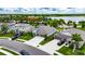 Street level aerial of suburban homes with multiple car garages and well manicured lawns at 5521 Olano St, Palmetto, FL 34221