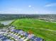 Great aerial view of the property set against sprawling green spaces, offering a serene and picturesque setting at 5540 Summit Gln, Bradenton, FL 34203
