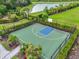 Aerial view of a well-maintained community basketball court surrounded by green space and landscaping at 5540 Summit Gln, Bradenton, FL 34203