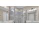Beautiful bathroom featuring a glass enclosed walk-in shower with grey tiled walls and dual sink vanities at 5540 Summit Gln, Bradenton, FL 34203