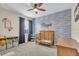 This charming bedroom features a unique wall design, stylish decor and plenty of natural light at 5540 Summit Gln, Bradenton, FL 34203