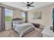 Calm bedroom featuring a comfortable bed, ample natural light, and neutral decor, a serene retreat at 5540 Summit Gln, Bradenton, FL 34203