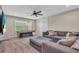 Enjoy this expansive living room featuring a cozy sectional sofa, a billiard table, and a large window at 5540 Summit Gln, Bradenton, FL 34203