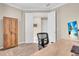 Neutral office with an ample desk, comfortable rolling chair, and natural light at 5540 Summit Gln, Bradenton, FL 34203
