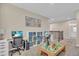 Spacious office area with two desks, built-in bookshelves, and a play area, perfect for a functional and fun workspace at 5540 Summit Gln, Bradenton, FL 34203