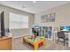 Bright office features a large window, two computer desks, and a toy table, ideal for work and play at 5540 Summit Gln, Bradenton, FL 34203