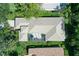 An aerial view displays the backyard, screened-in patio, and roof of this beautiful property at 5839 Los Verdes Ct, Bradenton, FL 34210