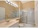 Neutral bathroom featuring a wide mirror and shower-tub combo at 5839 Los Verdes Ct, Bradenton, FL 34210