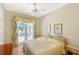 Cozy bedroom with French doors leading to an outdoor patio area at 5839 Los Verdes Ct, Bradenton, FL 34210
