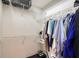 Organized walk-in closet with ample hanging space and shelving for clothing and accessories at 5839 Los Verdes Ct, Bradenton, FL 34210