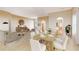 Open-concept living and dining space featuring hardwood floors, neutral walls, and modern furnishings at 5839 Los Verdes Ct, Bradenton, FL 34210