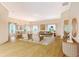 Inviting living room with hardwood floors, neutral paint, and natural light, complemented by modern furniture at 5839 Los Verdes Ct, Bradenton, FL 34210