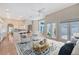 Open concept living room with natural light, hardwood floors, and seamless flow into the kitchen at 5839 Los Verdes Ct, Bradenton, FL 34210