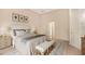 Inviting bedroom with a large bed, elegant decor, and neutral tones, creating a relaxing atmosphere at 5839 Los Verdes Ct, Bradenton, FL 34210