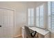 Bright office space with dual windows with plantation shutters and a built-in desk at 5839 Los Verdes Ct, Bradenton, FL 34210