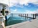 Exterior view of boat at the dock under sunny skies at 615 Dream Island Pl # 105, Longboat Key, FL 34228