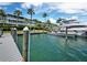 View of the building, yachts, and docks on the intercoastal waterway at 615 Dream Island Pl # 105, Longboat Key, FL 34228