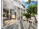 Exterior deck featuring partial view of building, and tropical vegetation with room for relaxing at 615 Dream Island Pl # 105, Longboat Key, FL 34228