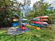 Organized kayak storage area set in a lush green space, providing convenient access for waterfront adventures at 615 Dream Island Pl # 105, Longboat Key, FL 34228