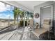 Relaxing lanai with comfortable seating and views of tropical landscape. Offers great area for outdoor enjoyment at 615 Dream Island Pl # 105, Longboat Key, FL 34228