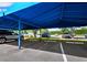 Designated covered parking with well-maintained landscaping, offering convenient and shaded parking spaces at 615 Dream Island Pl # 105, Longboat Key, FL 34228