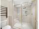 Well-appointed shower with glass enclosure, built-in seat, and tiled walls providing comfort and style at 615 Dream Island Pl # 105, Longboat Key, FL 34228