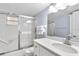 Bathroom featuring a shower/tub, white vanity, and modern fixtures at 6312 Midnight Pass Rd # 102S, Sarasota, FL 34242
