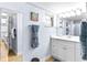 Bathroom with white vanity, tiled shower, and neutral decor at 6312 Midnight Pass Rd # 102S, Sarasota, FL 34242