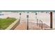 Beach access features brick steps with handrail to sandy shore and the Gulf of Mexico at 6312 Midnight Pass Rd # 102S, Sarasota, FL 34242