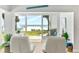Beautiful beach view through sliding glass doors from the interior space at 6312 Midnight Pass Rd # 102S, Sarasota, FL 34242