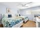 Light and airy bedroom with two beds, ceiling fan, and neutral decor at 6312 Midnight Pass Rd # 102S, Sarasota, FL 34242
