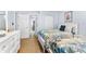 Light and airy bedroom with two beds, dresser, and neutral decor at 6312 Midnight Pass Rd # 102S, Sarasota, FL 34242