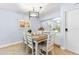 Charming dining area adjacent to the kitchen, perfect for Gathering meals at 6312 Midnight Pass Rd # 102S, Sarasota, FL 34242