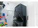 Laundry room area featuring a modern stackable washer and dryer at 6312 Midnight Pass Rd # 102S, Sarasota, FL 34242