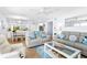 Comfortable living room with dining area and view of kitchen at 6312 Midnight Pass Rd # 102S, Sarasota, FL 34242