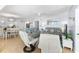 Cozy living room with dining area and view of kitchen at 6312 Midnight Pass Rd # 102S, Sarasota, FL 34242